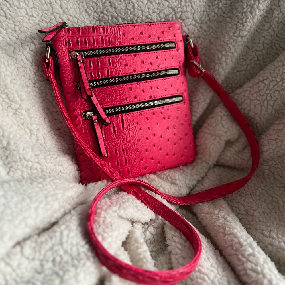 Large pink alligator crossbody bag